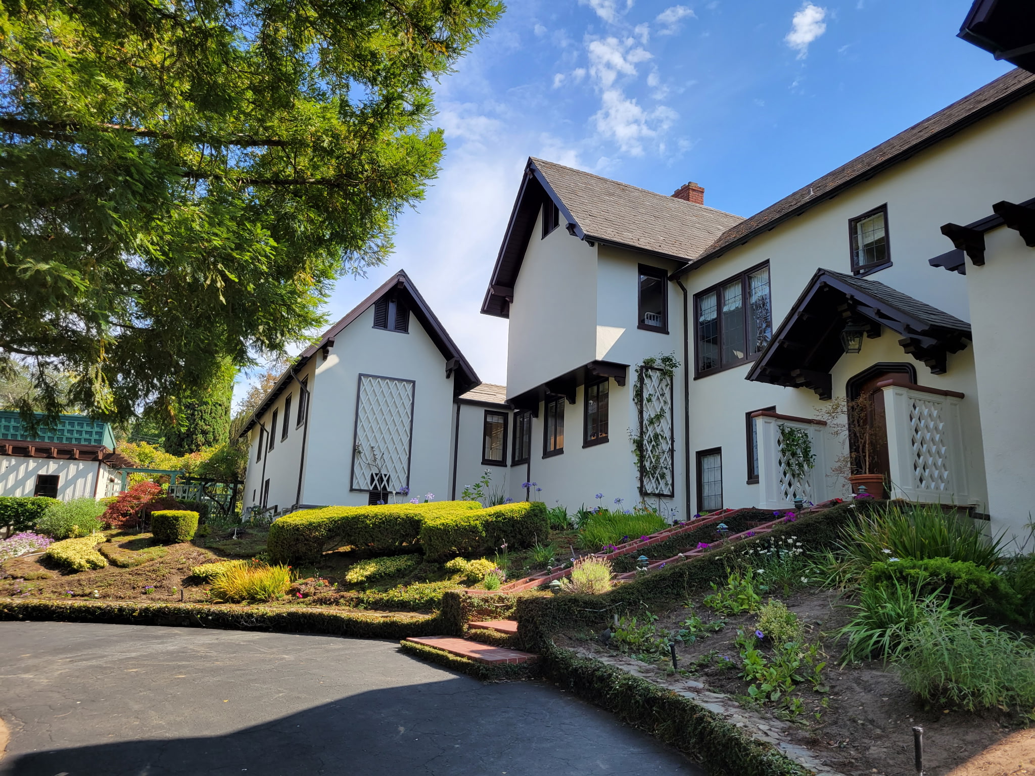 Tudor-style home exterior with landscaped front garden
